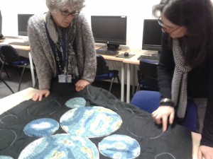 Kaye and Jackie discussing Alke's quilt